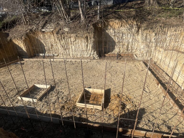 DMV soil and water table — clay soil saturation and hydrostatic pressure against basement wall