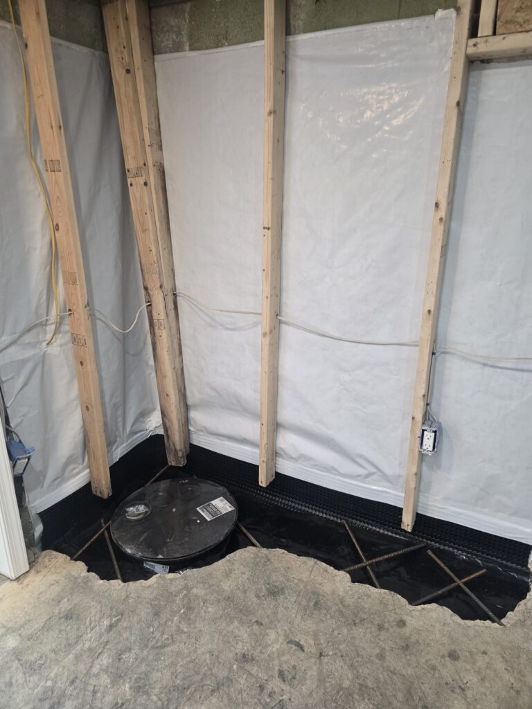 basement waterproofing cost maryland breakdown showing engineer-installed interior drainage and sealed sump basin