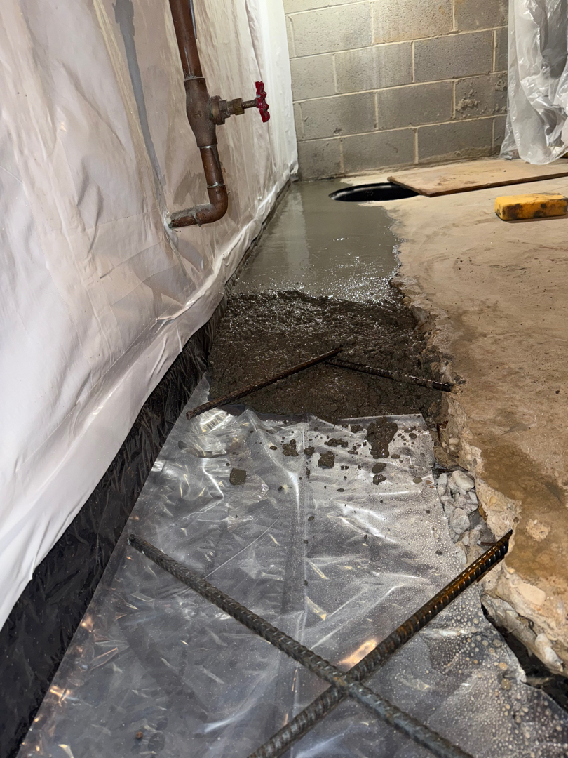 Interior drain covered and basement slab restored over the new FootingShield line — Silver Spring, MD
