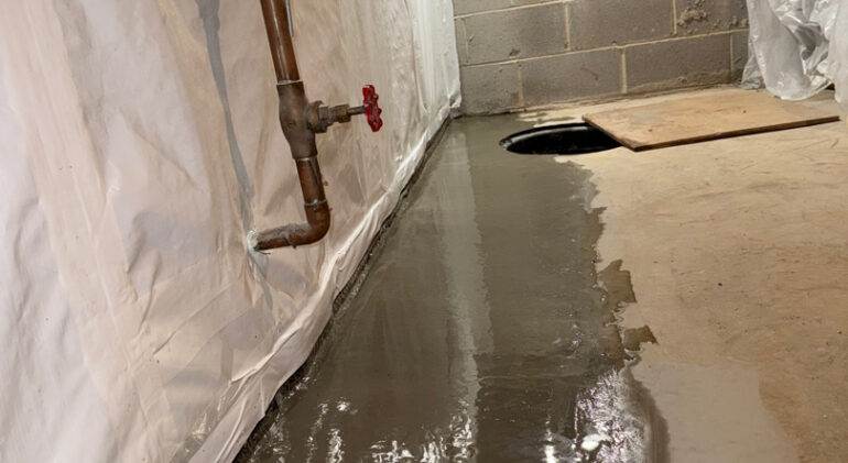 Cracks in the Corner, Mold in the Air: Drying a Silver Spring Townhouse From the Inside 3 Finished, dry basement with restored slab and wall vapor barrier — Silver Spring, MD