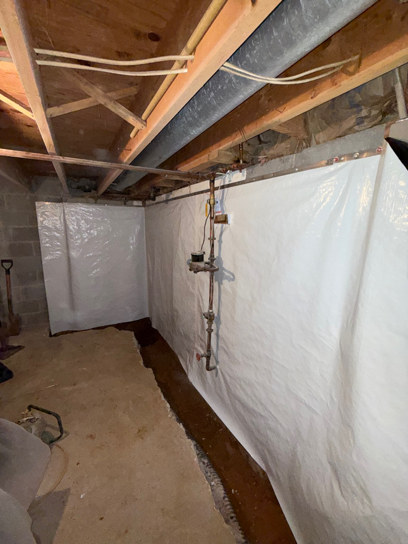 Vapor barrier installed on the basement foundation walls in Silver Spring, MD