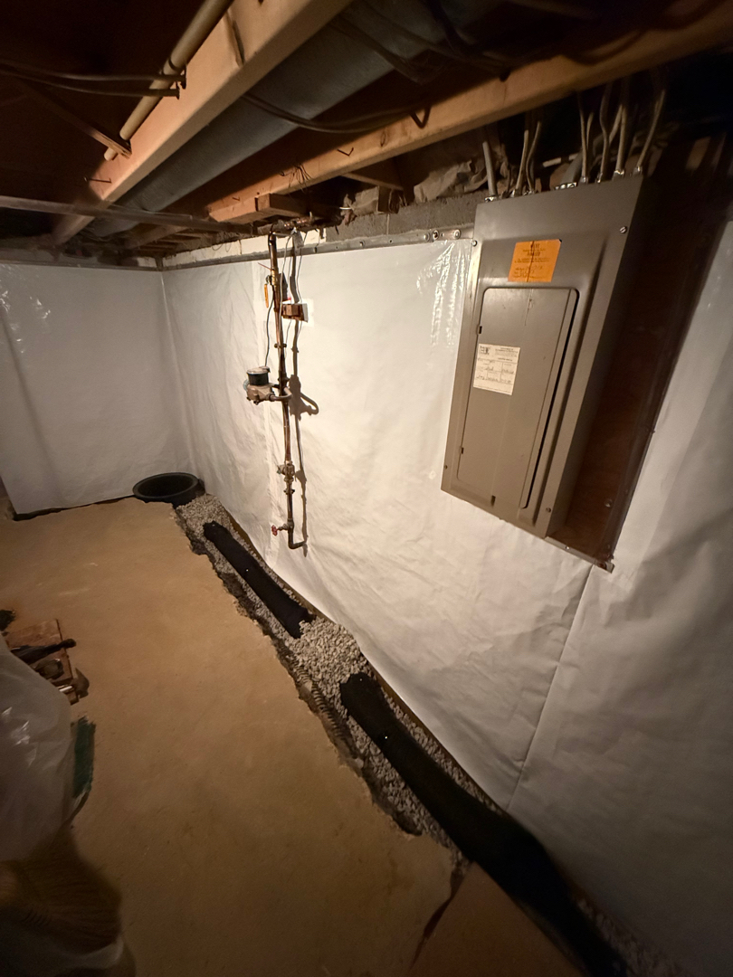 Interior drain trench run along the foundation wall — Silver Spring basement