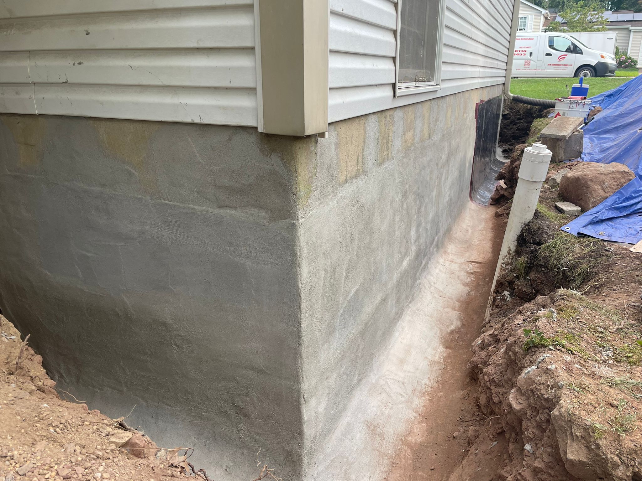 Cementitious waterproofing coat parged over the block foundation wall — Ashburn, VA
