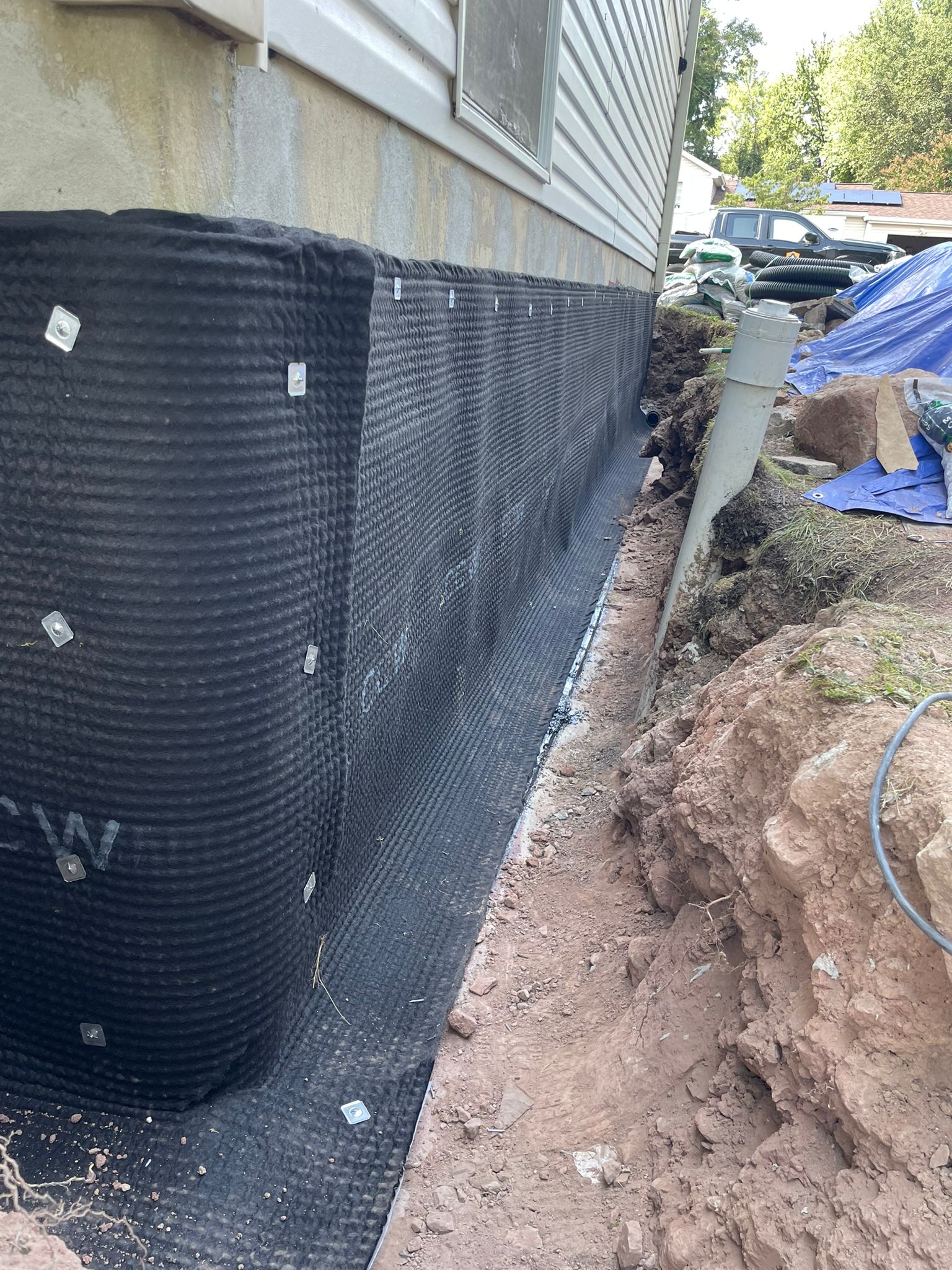 Dimple drain board fastened over the waterproofing membrane — Ashburn, VA
