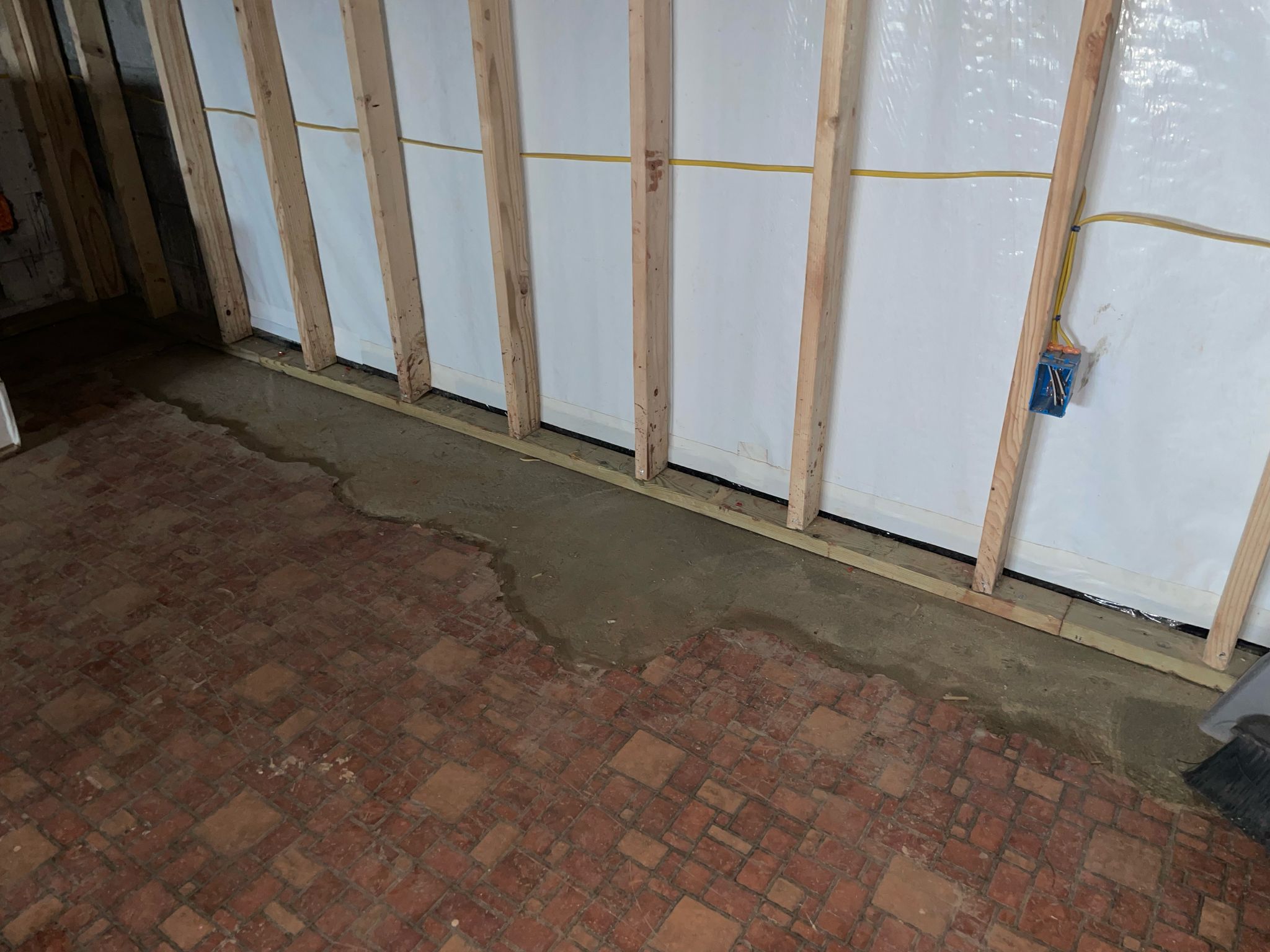 Wall vapor barrier installed over the basement framing — Manassas, VA