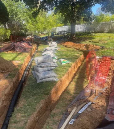 gaithersburg-yard-french-drain-trench Yard French drain trench during installation at a Gaithersburg, Maryland home