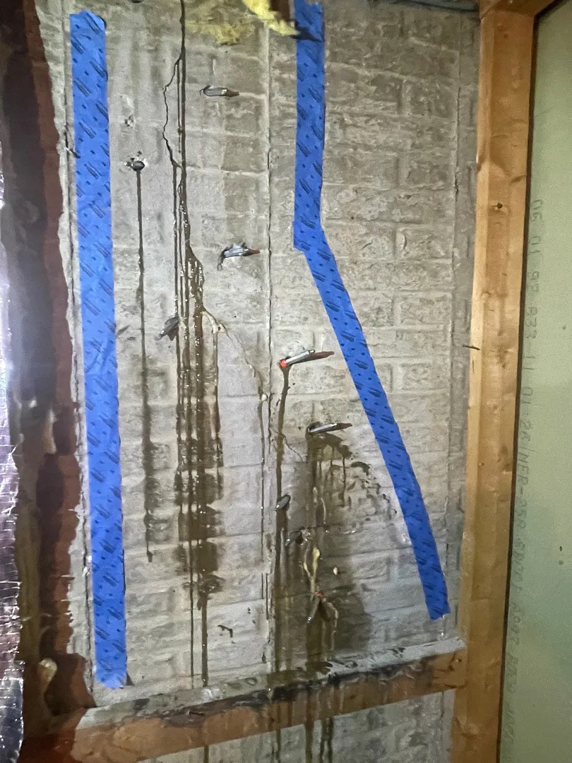 Injection packers installed along a cracked patterned wall during Silver Spring repair