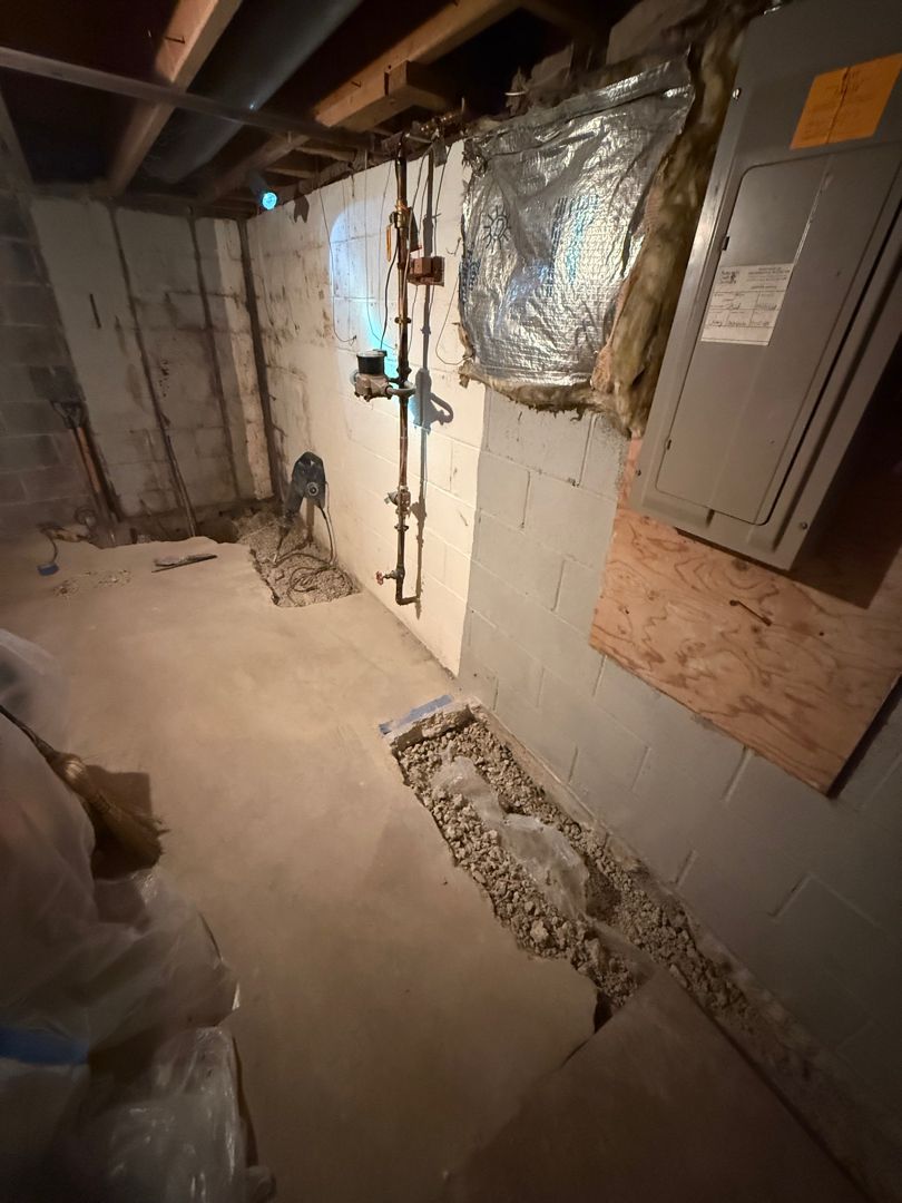 Water Around Basement Foundation Walls in Silver Spring, MD: Interior Drain Case 1 Perimeter concrete opened beside a Silver Spring basement foundation wall