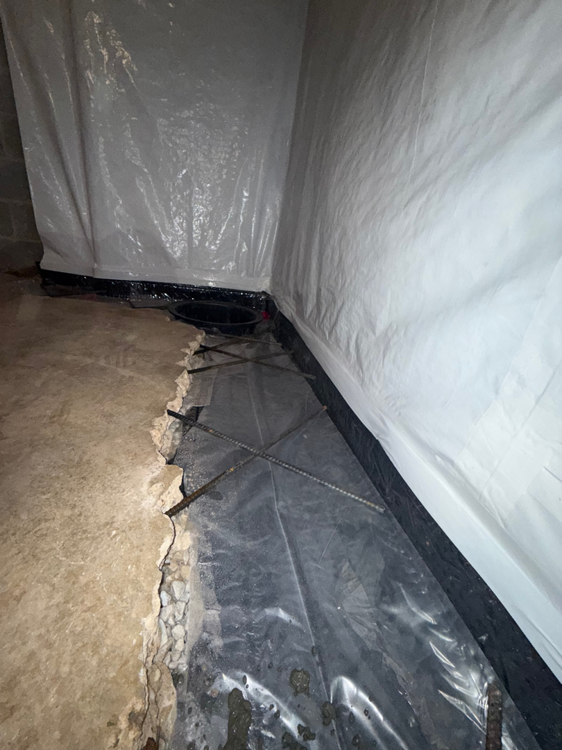 Water Around Basement Foundation Walls in Silver Spring, MD: Interior Drain Case 3 Rebar reinforcement across opened interior basement slab edge before concrete placement