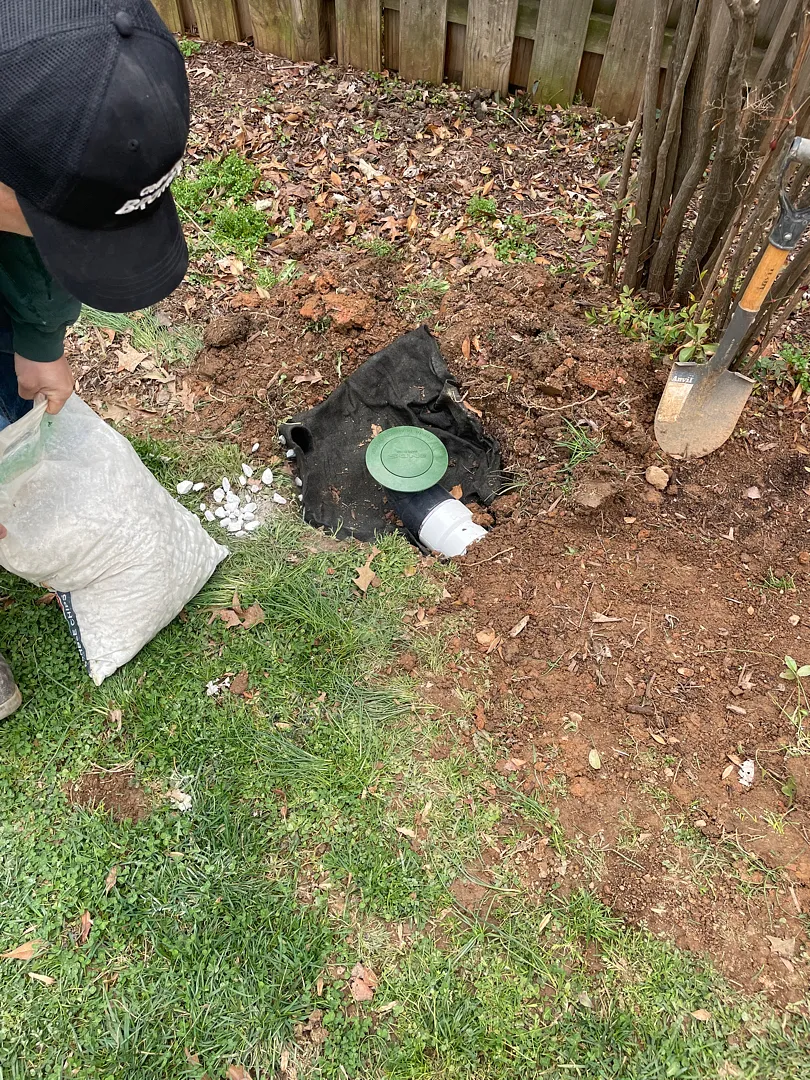 Outdoor pop-up emitter being installed for the Silver Spring sump pump discharge