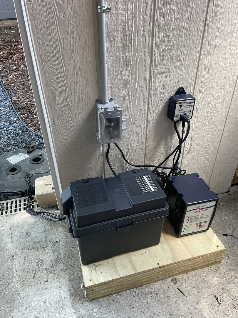Battery and control equipment beside the Alexandria home during drainage work