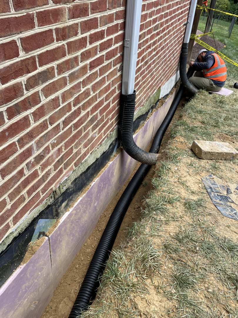 XPS protection board and buried pipe work beside an excavated Bethesda foundation