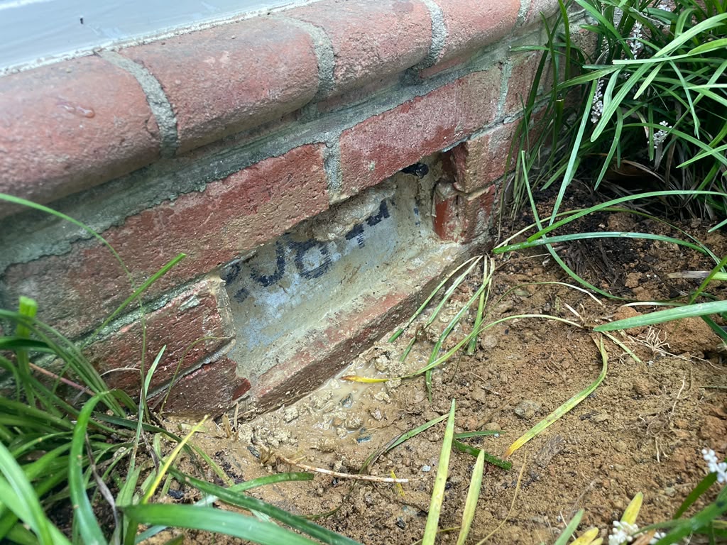 Basement Vent Leak Repair in Potomac, MD | Real Case 2 Brick vent opening during a targeted exterior sealing repair