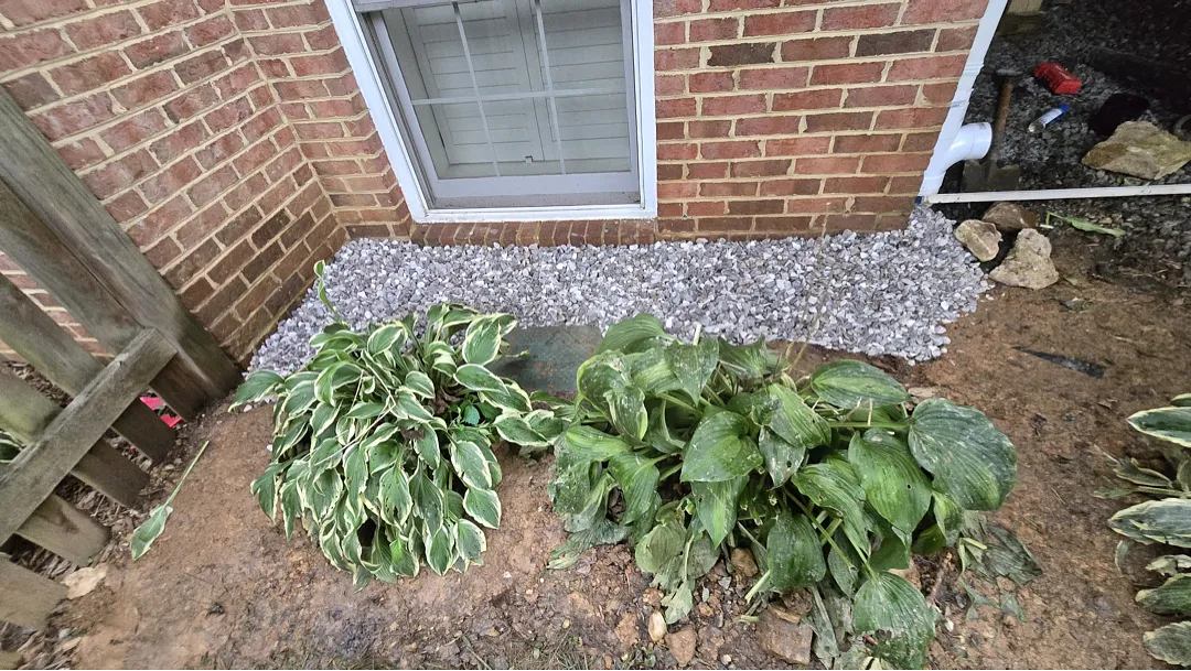 Finished gravel drainage strip beneath the window at the Dunn Loring home