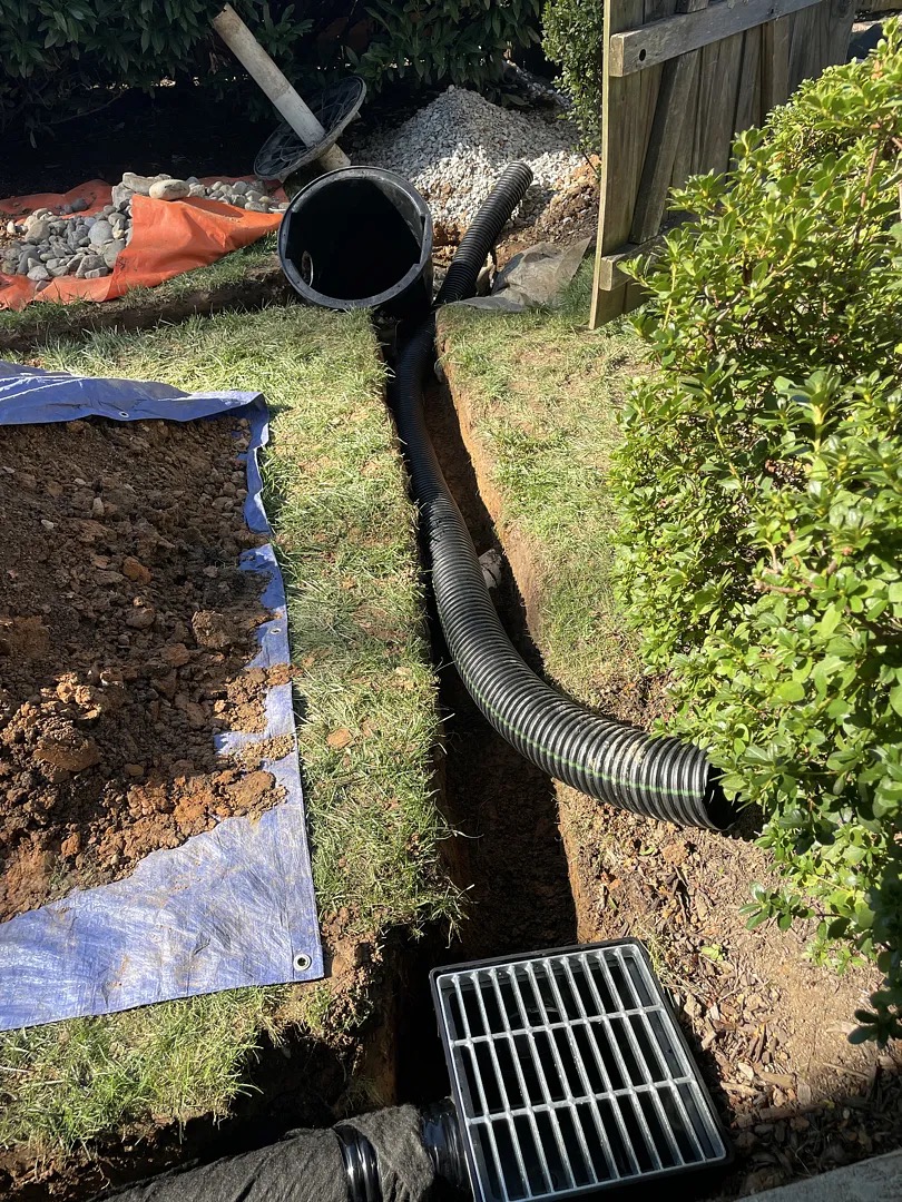 Surface-water catch basin and buried drainage pipe during installation