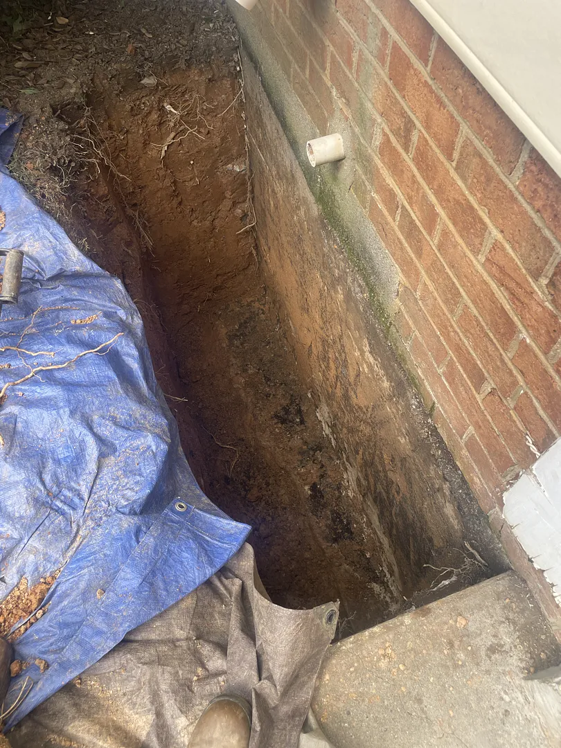 Hand-excavated trench beside the North Potomac foundation wall